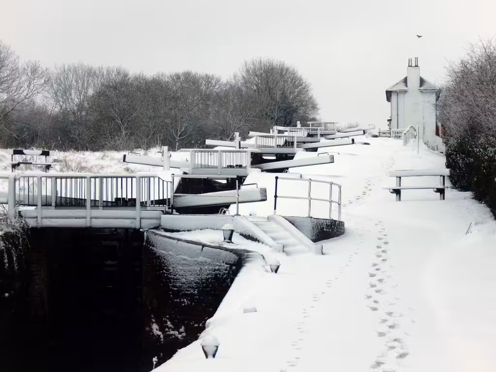 Snow on the lock gates and towpath of the staircase locks at Foxton, Leicestershire