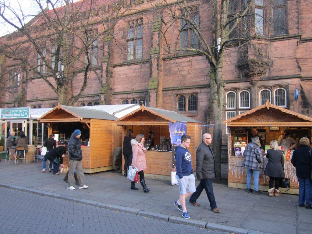 Wooden Christmas market stalls in an English town centre in December